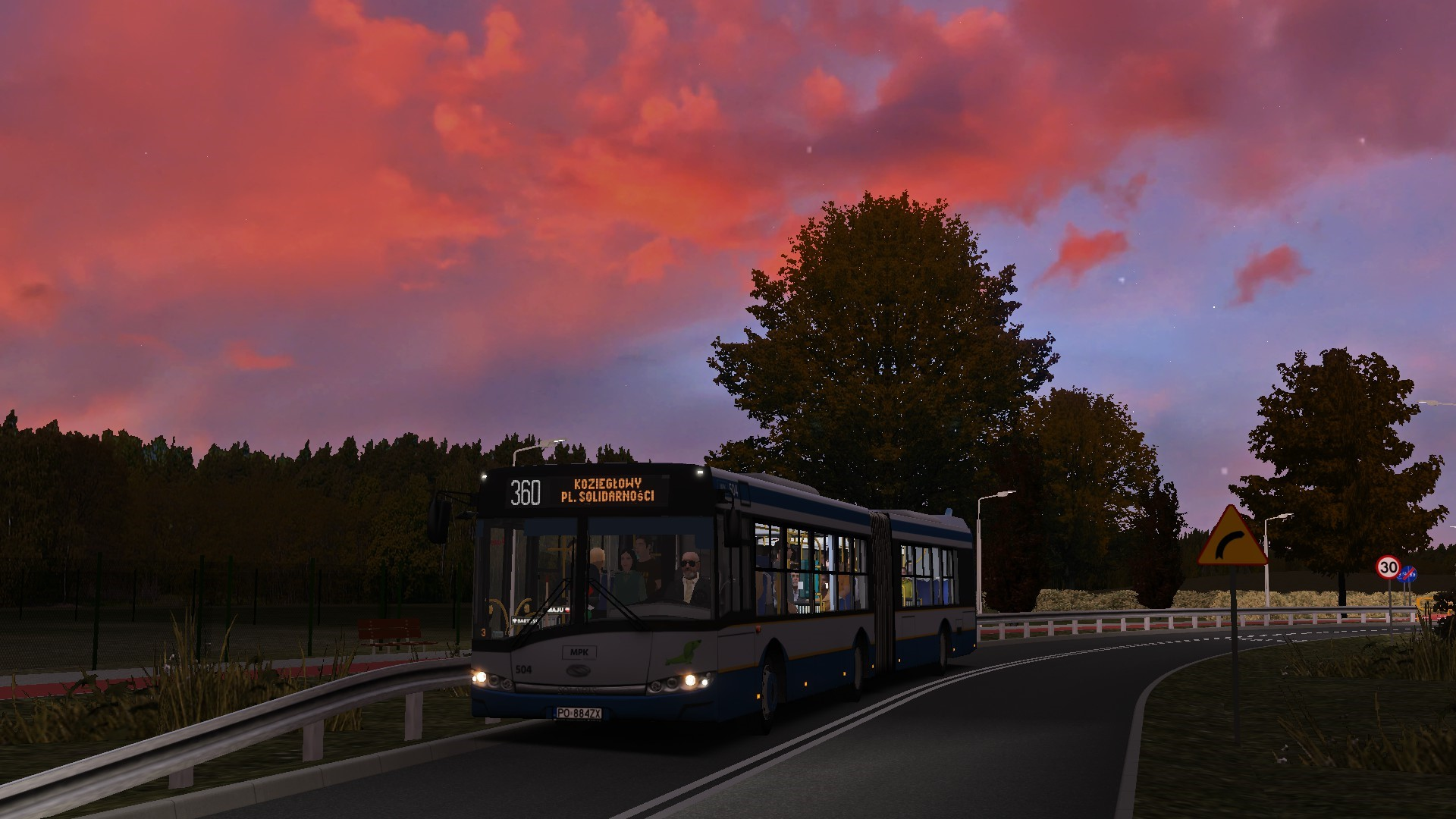 Close-up of a computer screen displaying programming code in a dark environment.